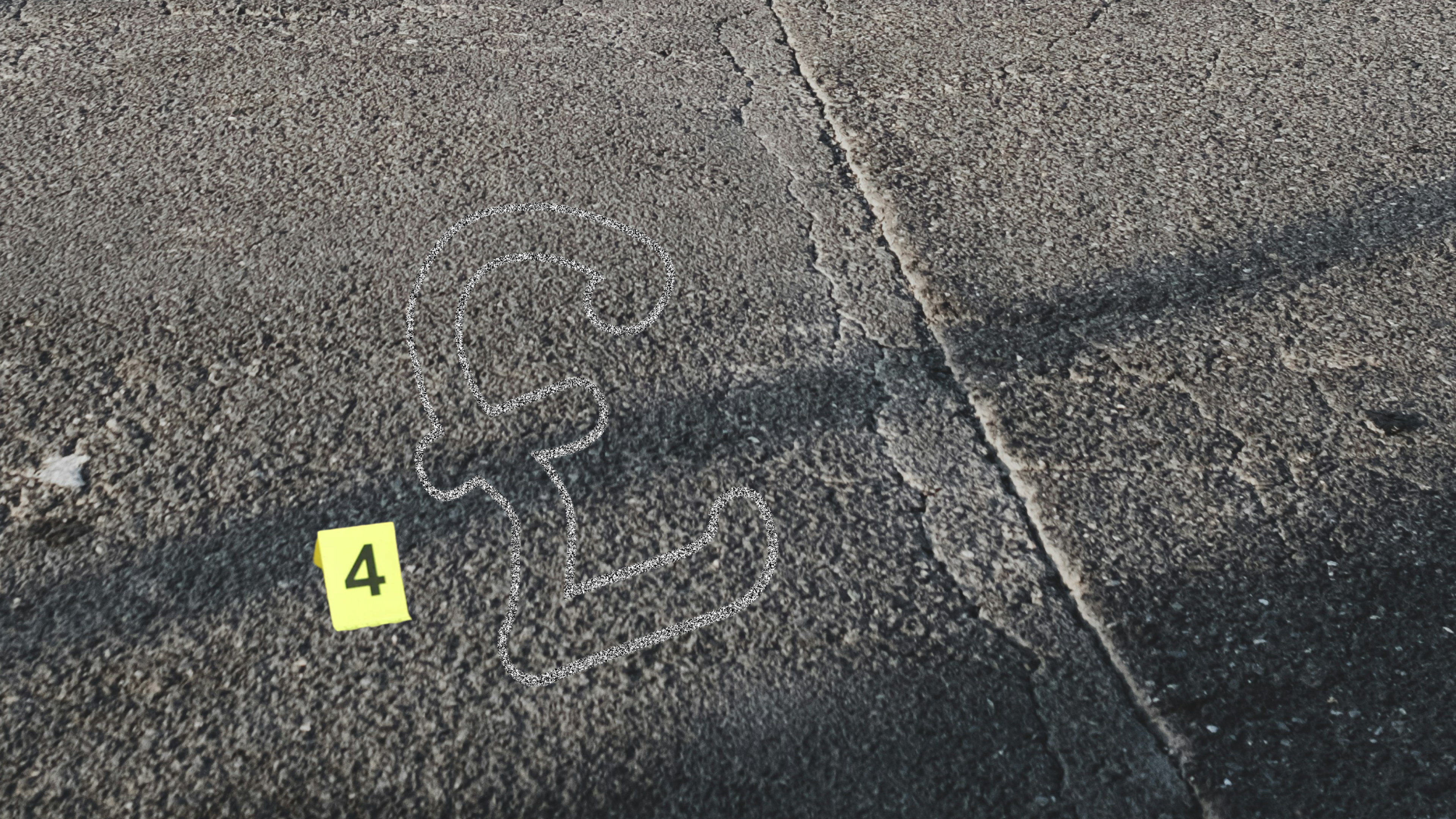 an outline of a pound sign written in chalk on the road with a crime scene marker next to it