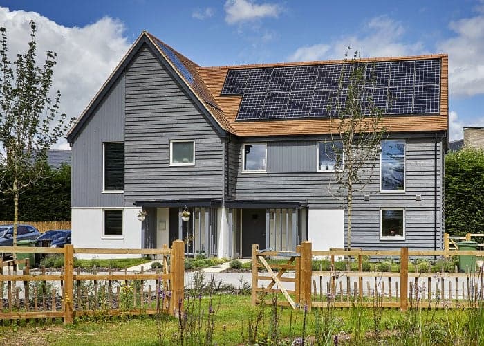 Two story house with different cladding styles